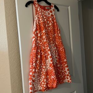 Orange and white flowered Trina Turk dress. Worn once! Size 12. Back cut out.
